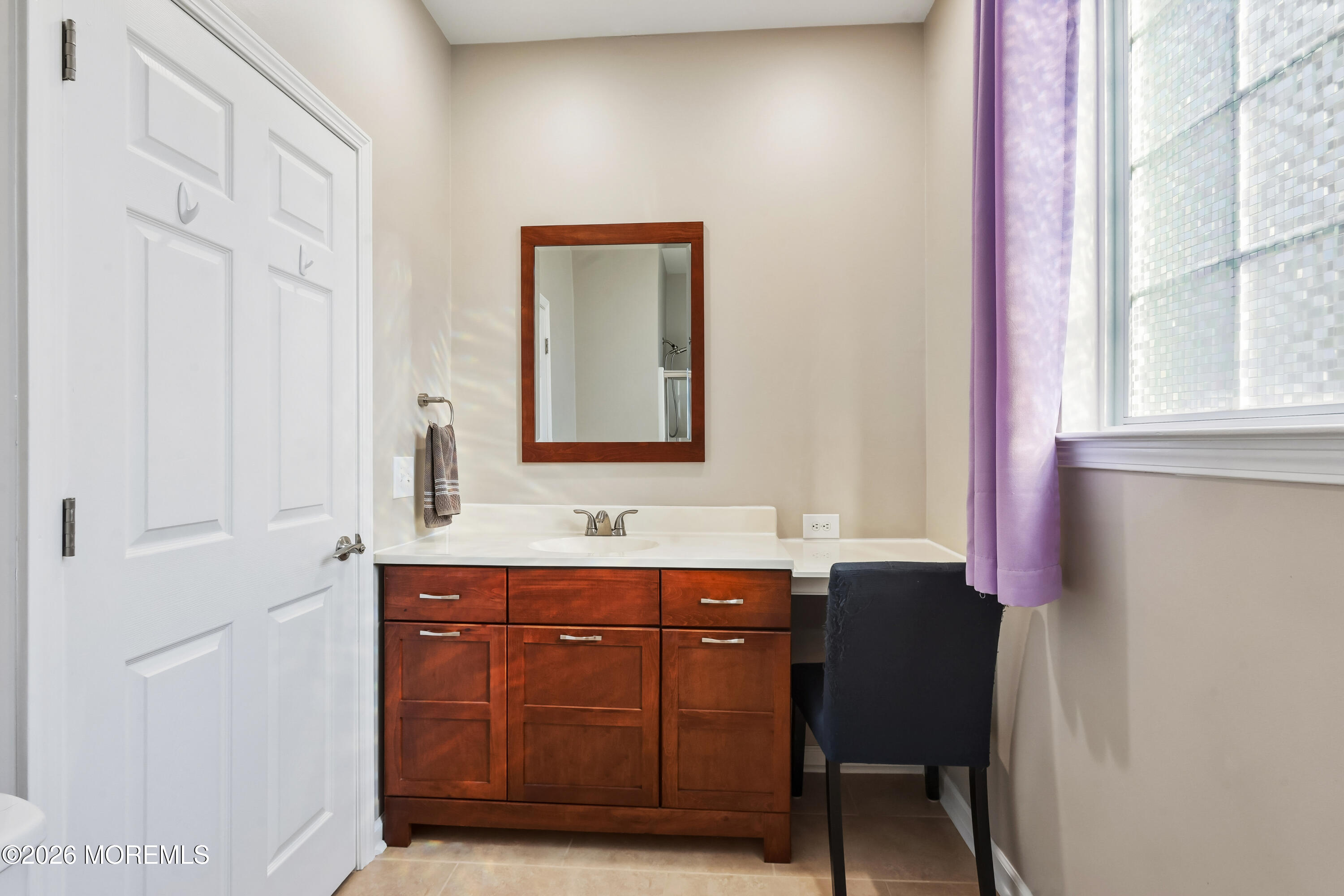66 Sandpiper Road Barnegat, NJ 08005 - Photo 19 of 25 a bathroom with a sink and a mirror