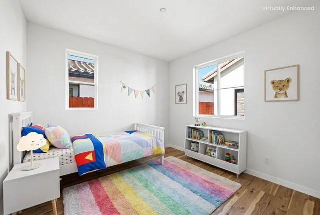 a bedroom with furniture and a window