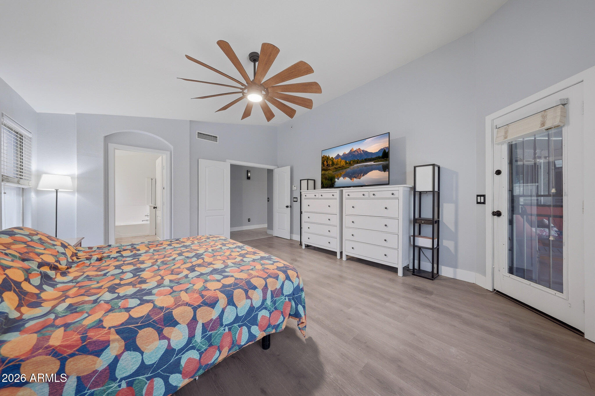2153 East Kempton Road Chandler, AZ 85225 - Photo 19 of 50 a bedroom with a bed and a chandelier