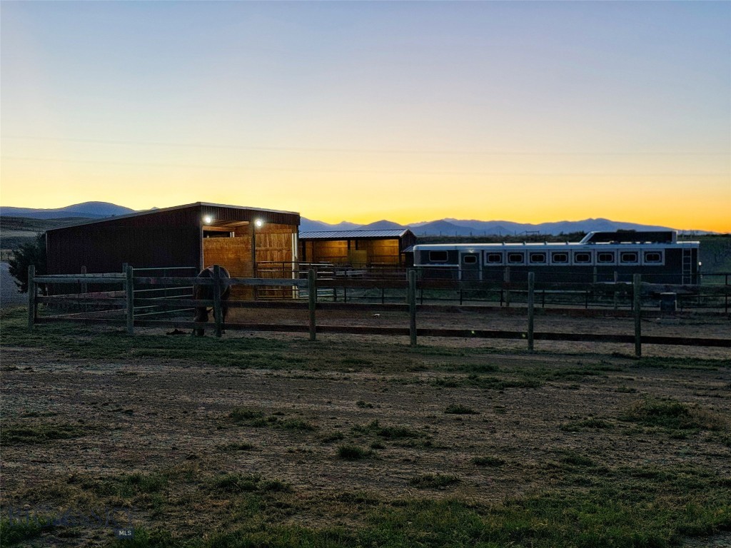 600 Blue Ribbon Lane Dillon, MT 59725 - Photo 37 of 65 Night View of Paddocks/shelters next to Farm House