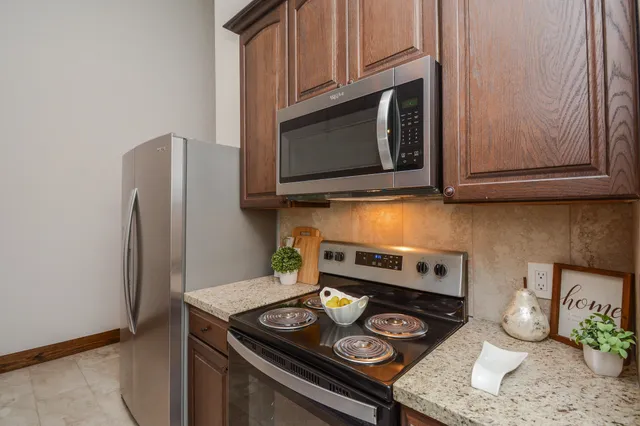 a kitchen with a stove and a microwave