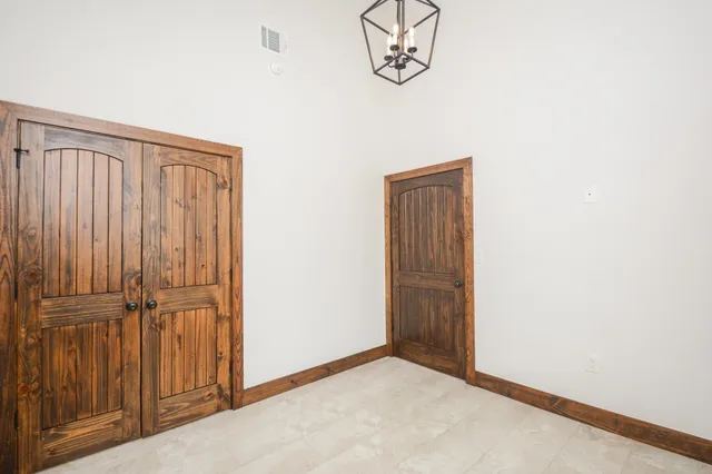 an empty room with a wooden door