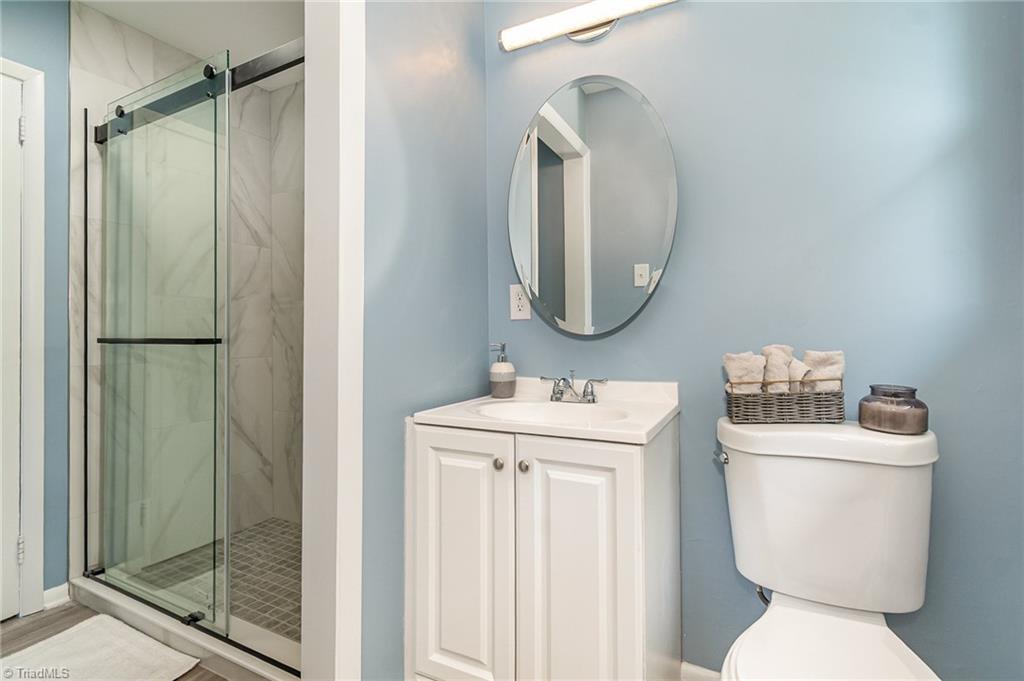 2102 Castlerock Road Greensboro, NC 27406 - Photo 16 of 32 Hall Bathroom with new tiled shower