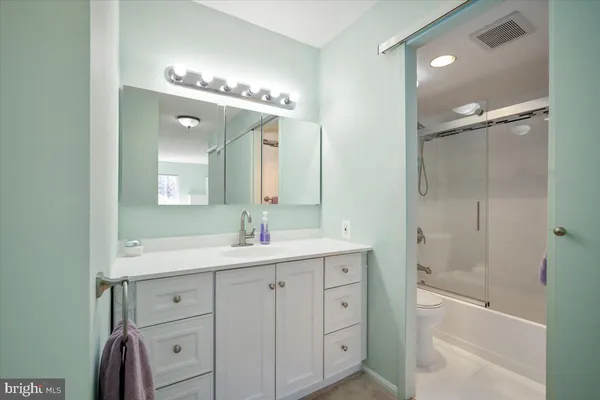 a bathroom with a shower and a toilet