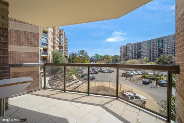 a living room with couches a dining table and chairs with outer view