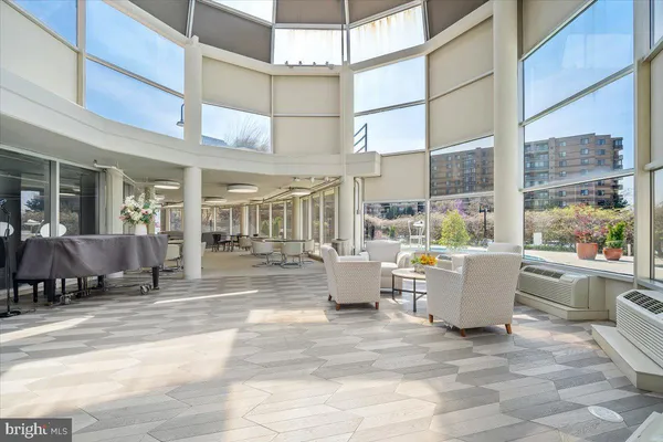 a view of a patio with dining table and chairs