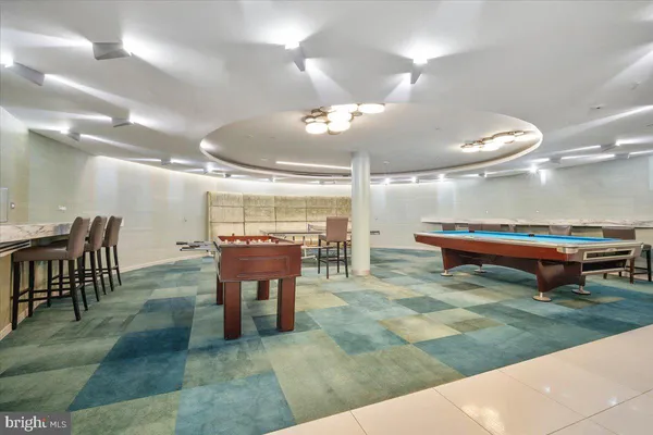 a view of a room with furniture and screen