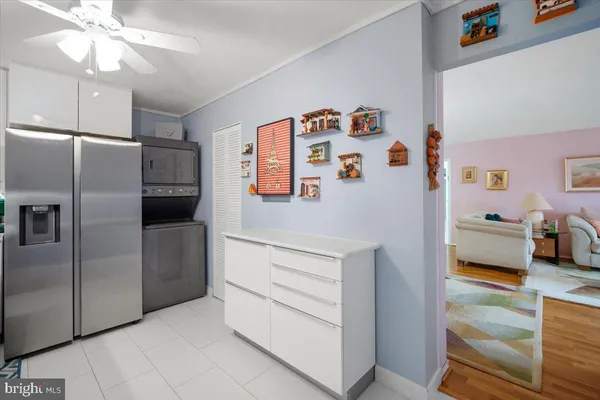 a kitchen with stainless steel appliances a refrigerator and a stove