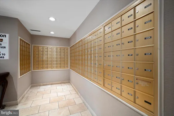 a view of an entryway with wooden floor and windows
