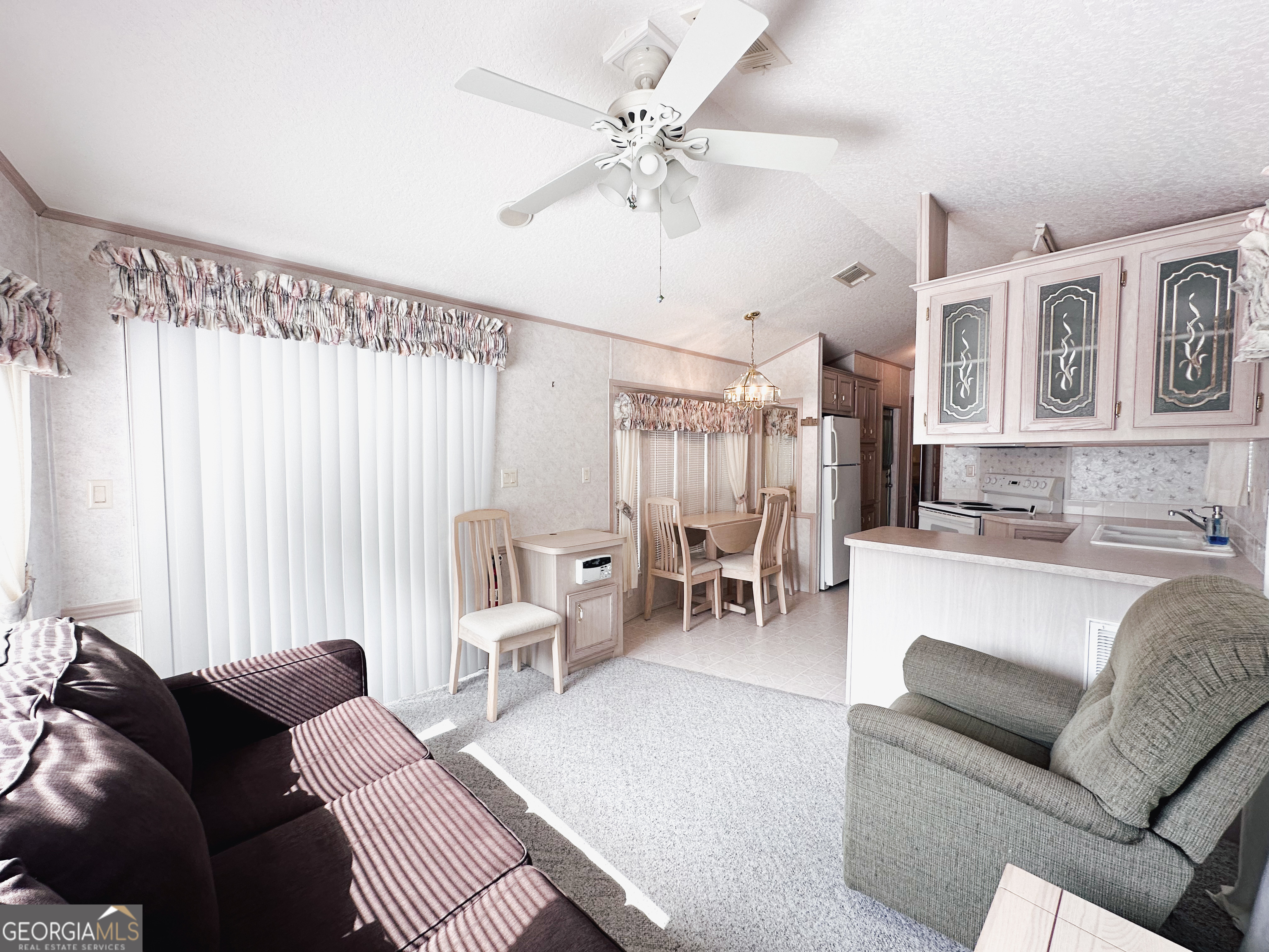 68 Nomad Trail Cleveland, GA 30528 - Photo 7 of 20 a living room with furniture and a chandelier