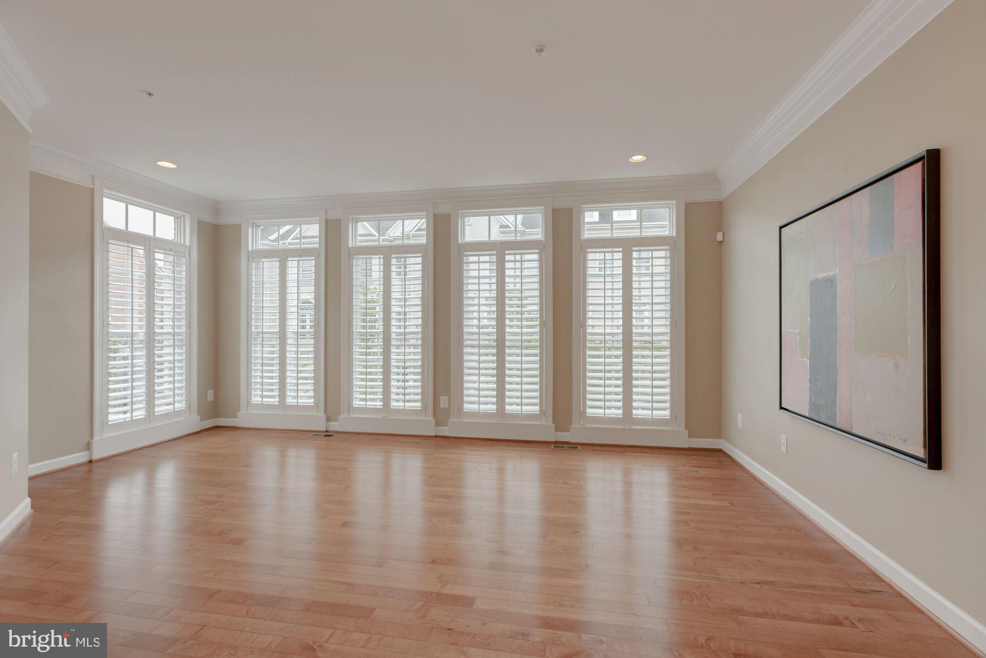 5146 Brawner Place Alexandria, VA 22304 - Photo 11 of 32 a view of an empty room with wooden floor and a window