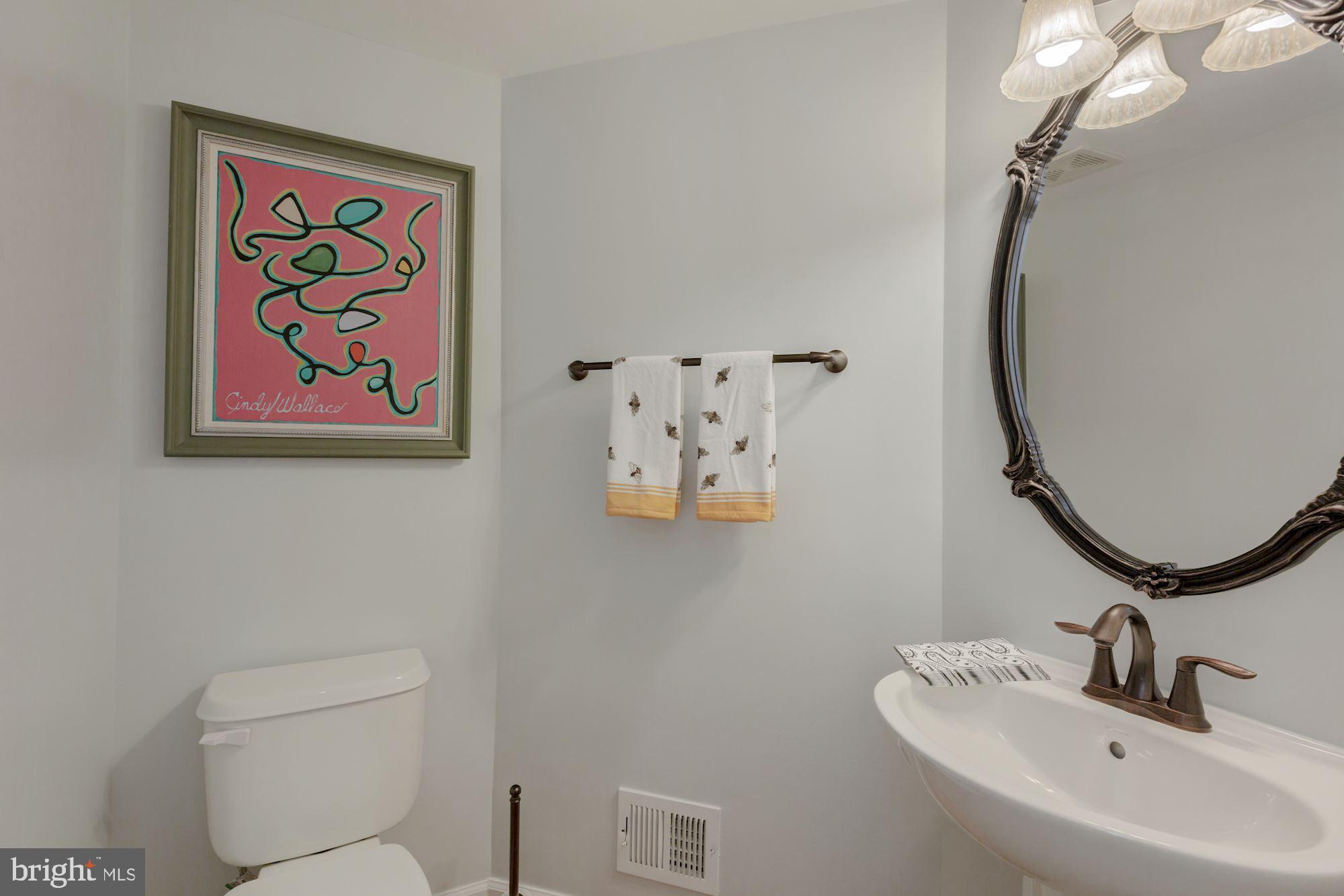 5146 Brawner Place Alexandria, VA 22304 - Photo 12 of 32 a bathroom with a sink and mirror with toilet