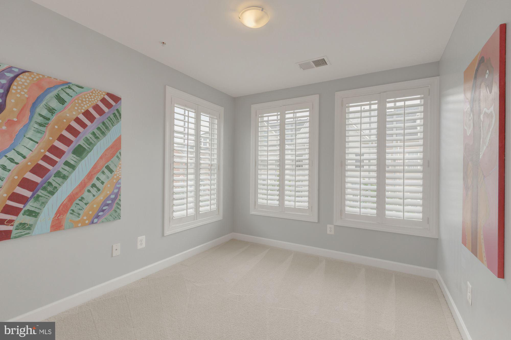 5146 Brawner Place Alexandria, VA 22304 - Photo 16 of 32 a view of an empty room with a window and a kitchen