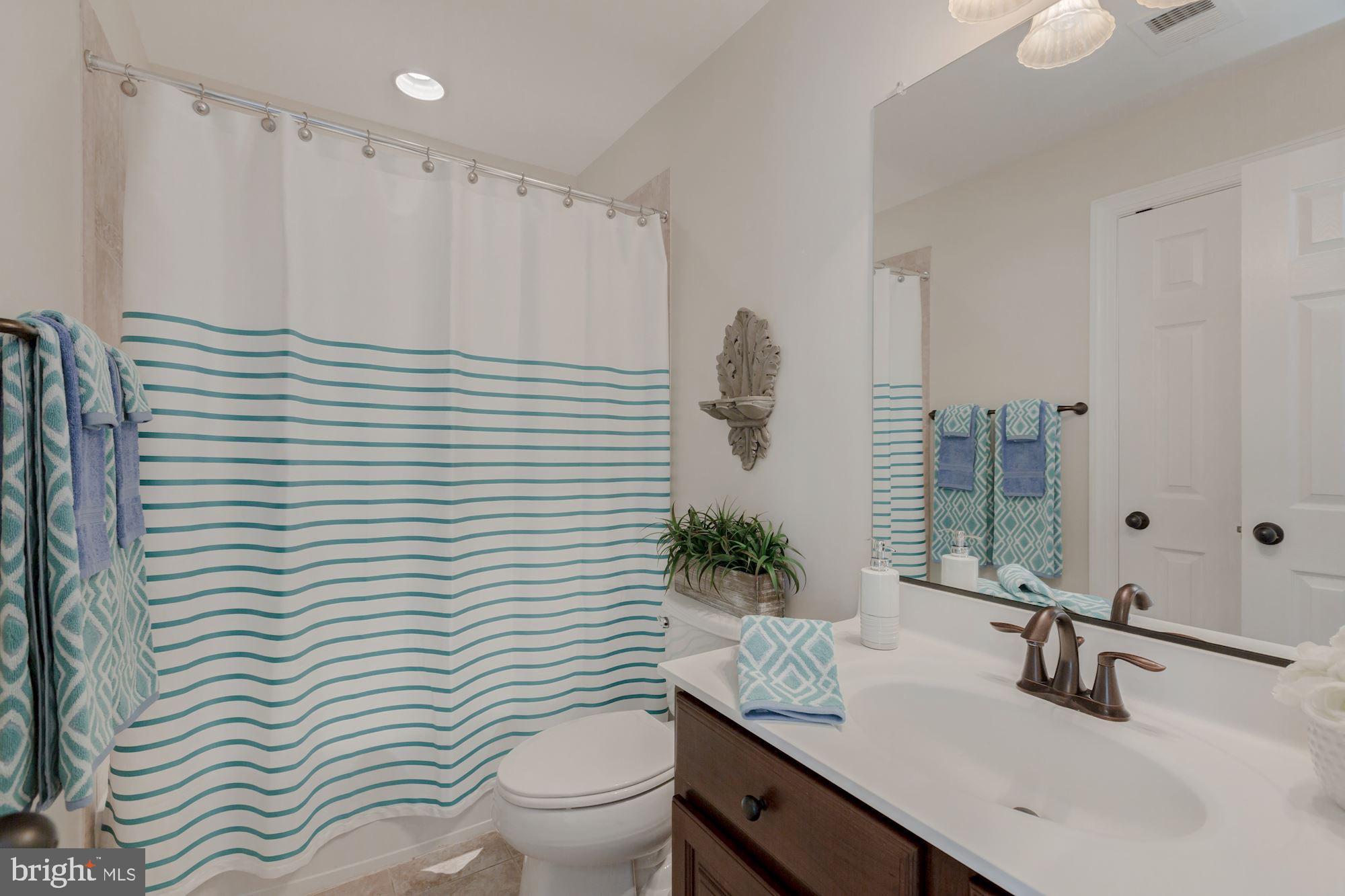 5146 Brawner Place Alexandria, VA 22304 - Photo 17 of 32 a bathroom with a sink and a mirror