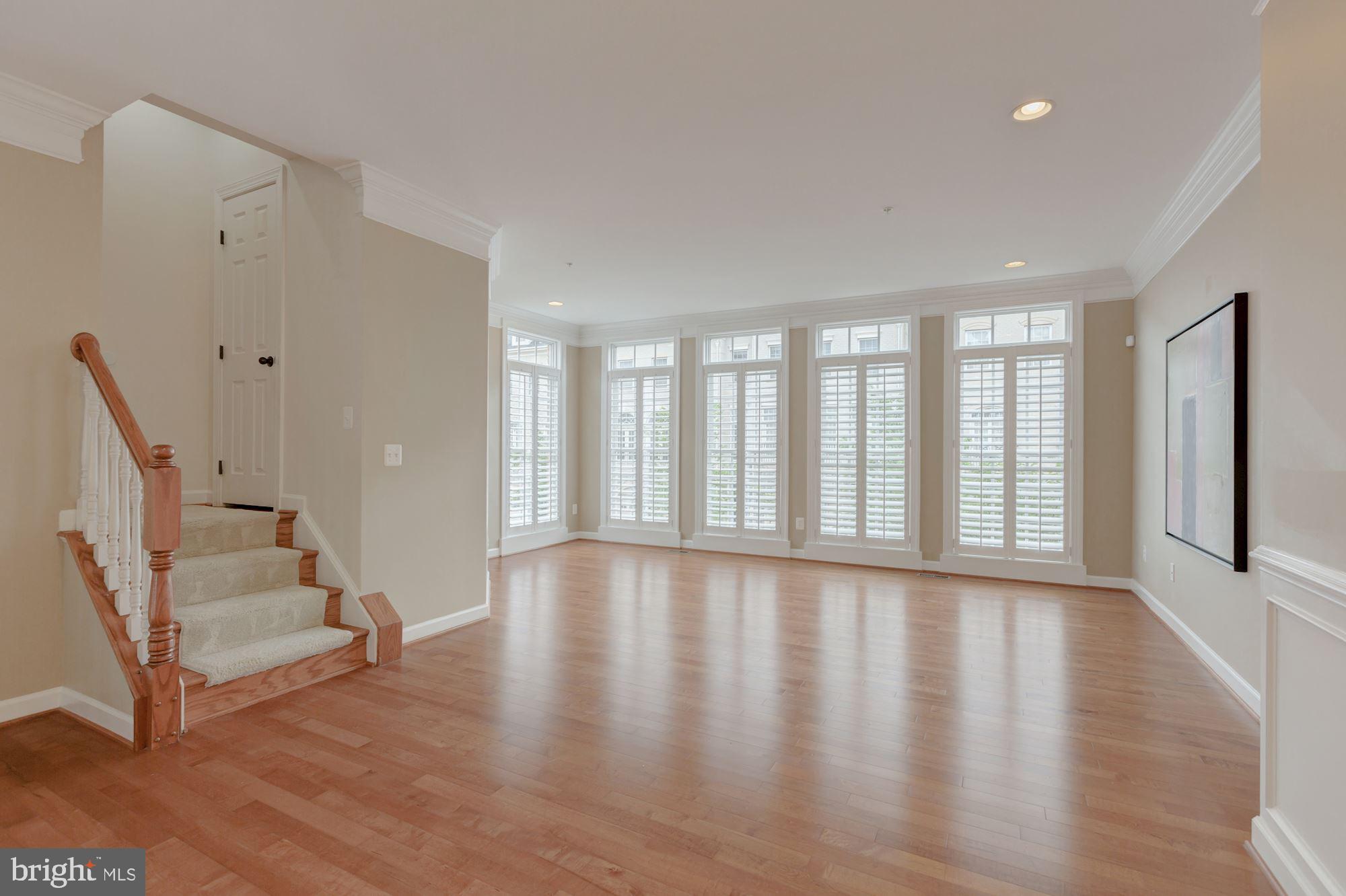 5146 Brawner Place Alexandria, VA 22304 - Photo 9 of 32 a view of an empty room with wooden floor and a window