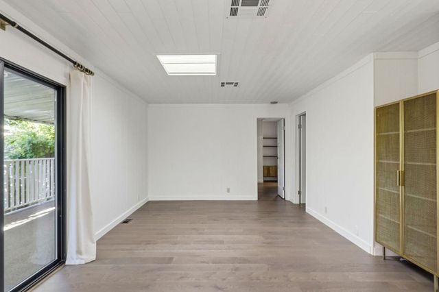 a kitchen with stainless steel appliances granite countertop a sink and a refrigerator