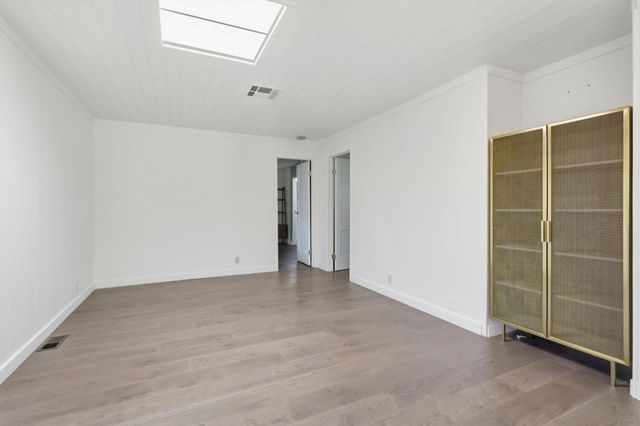 a kitchen with stainless steel appliances granite countertop a refrigerator and a stove