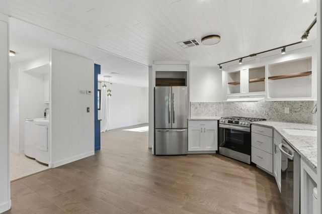 an empty room with white walls and white walls