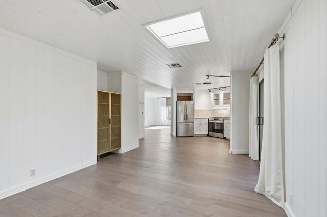 an empty room with a mirror