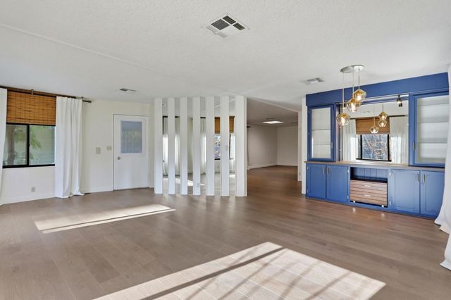 a view of room with window and hallway