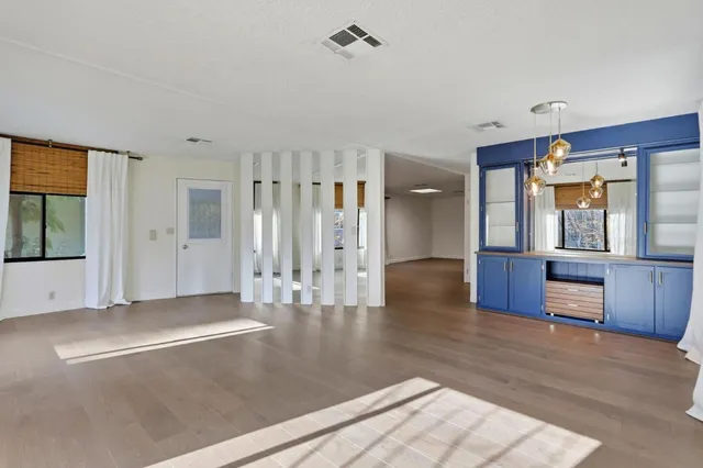 a view of room with window and hallway