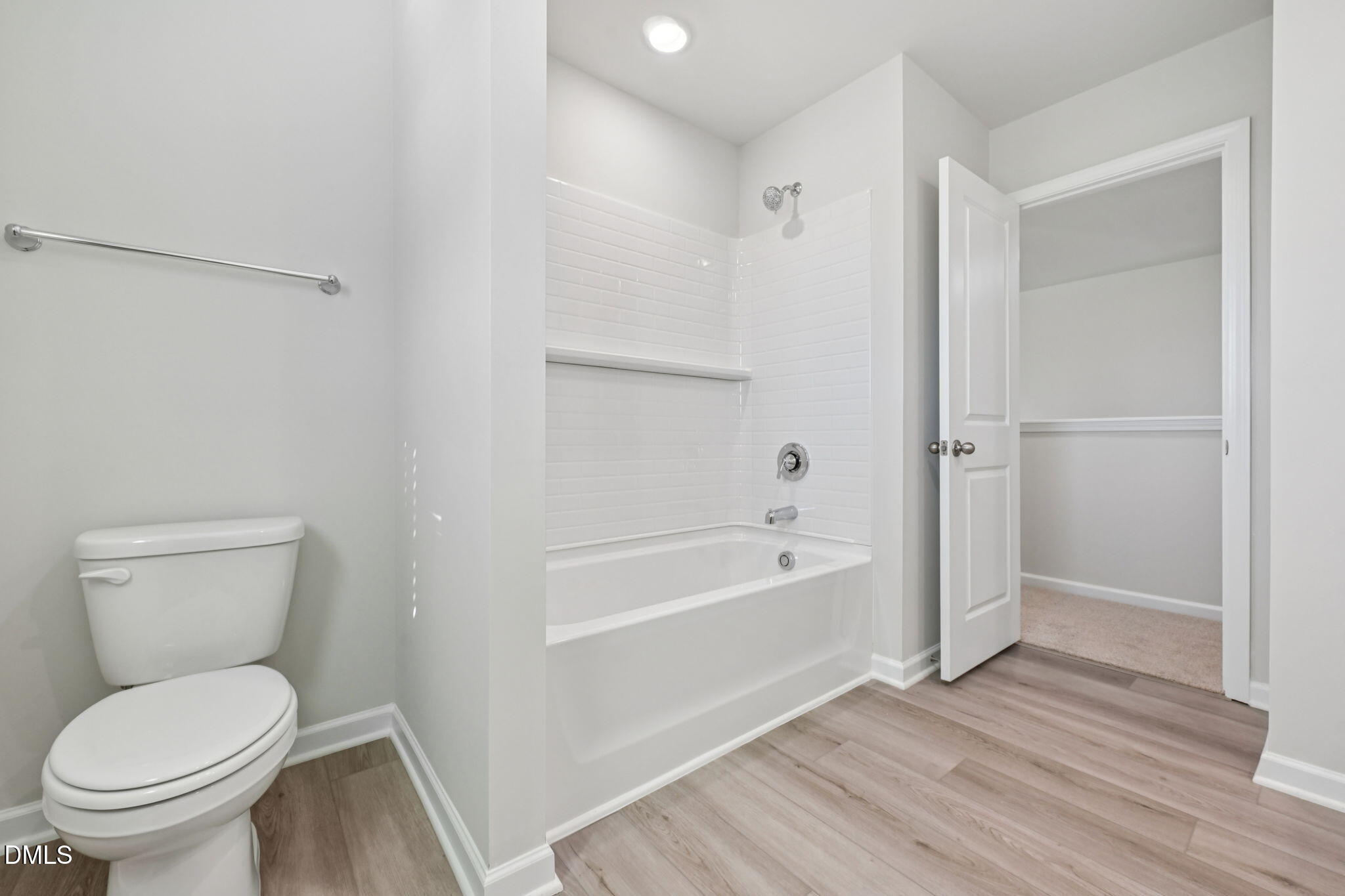 2145 Topsail Road Durham, NC 27703 - Photo 33 of 49 a bathroom with a toilet and a tub