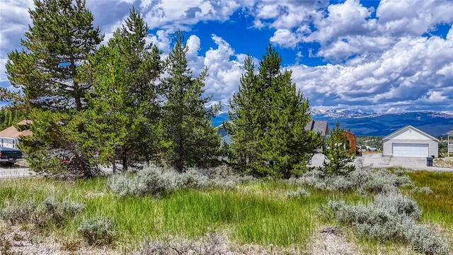a view of house with a yard