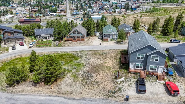 a aerial view of a house with garden space and lake view