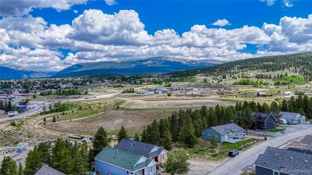 a view of a pathway with a garden
