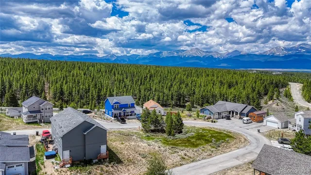 a view of a garden with furniture