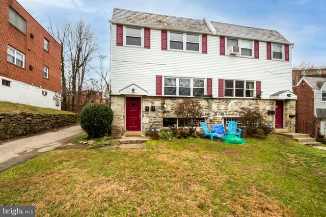 a view of a brick building with many windows