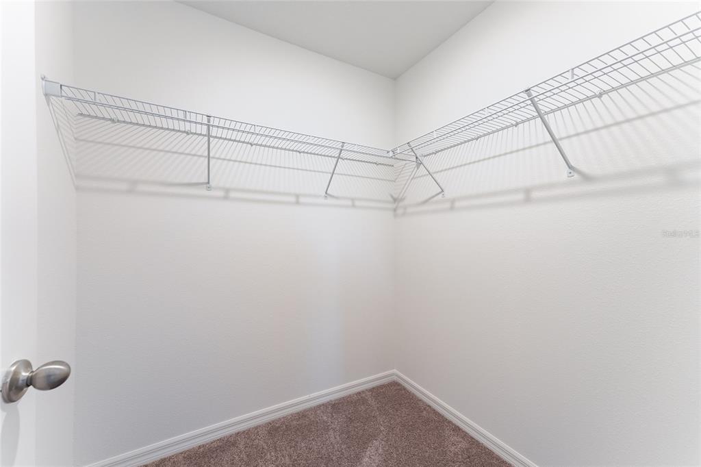 2770 Raindrop Run Street Clermont, FL 34714 - Photo 14 of 28 a view of a room with racks on the wall