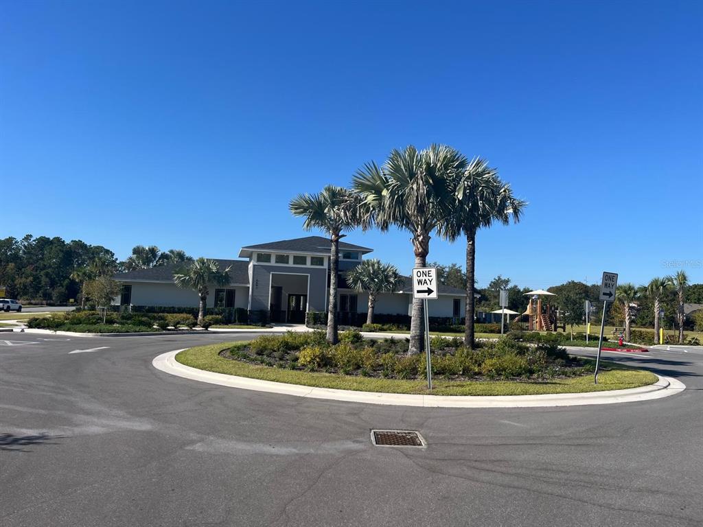 2770 Raindrop Run Street Clermont, FL 34714 - Photo 22 of 28 a view of swimming pool with outdoor seating and plants