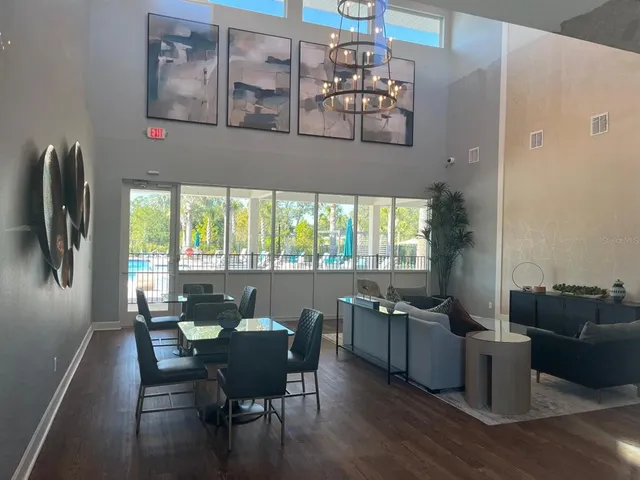 a backyard of a house with table and chairs