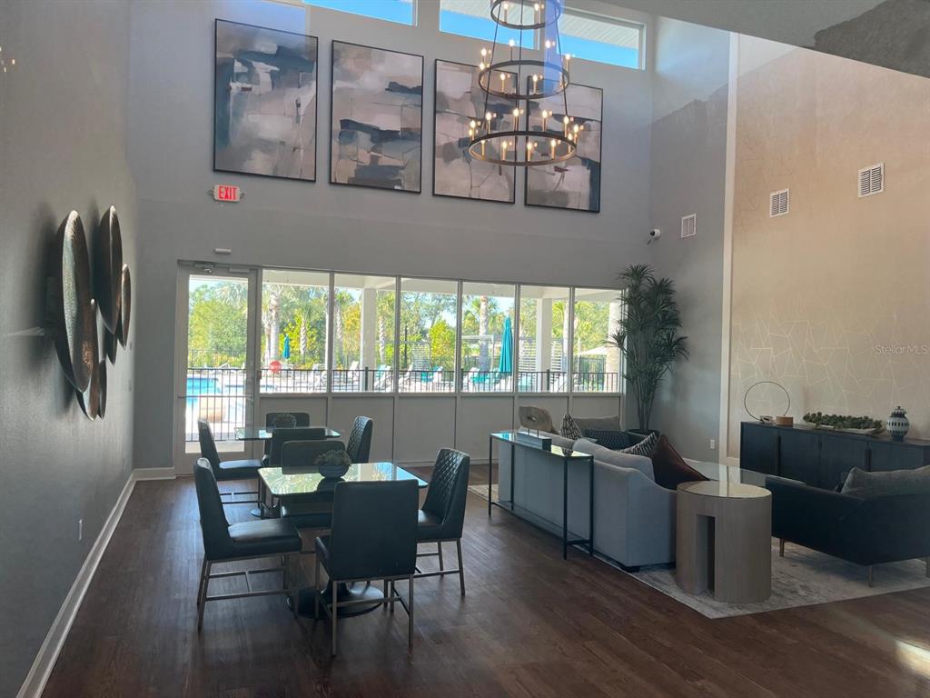 2770 Raindrop Run Street Clermont, FL 34714 - Photo 25 of 28 a view of a dining room with furniture window and outside view