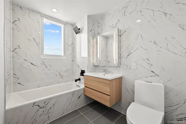 a bathroom with a bathtub and sink