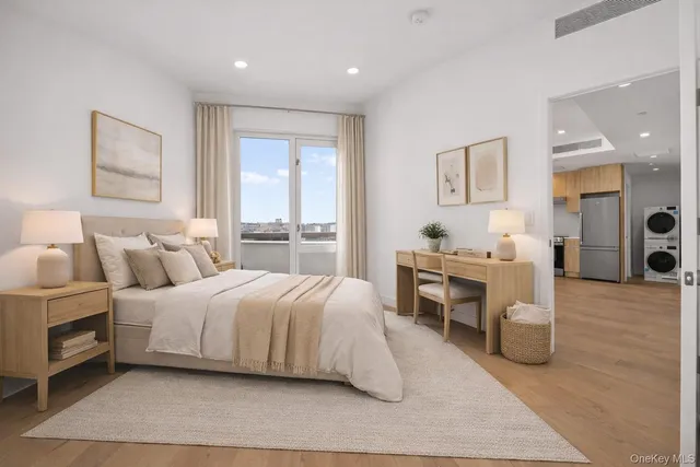 a bedroom with a bed and a table