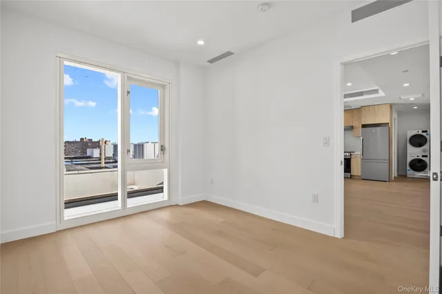 a bathroom with a sink mirror vanity and bathtub