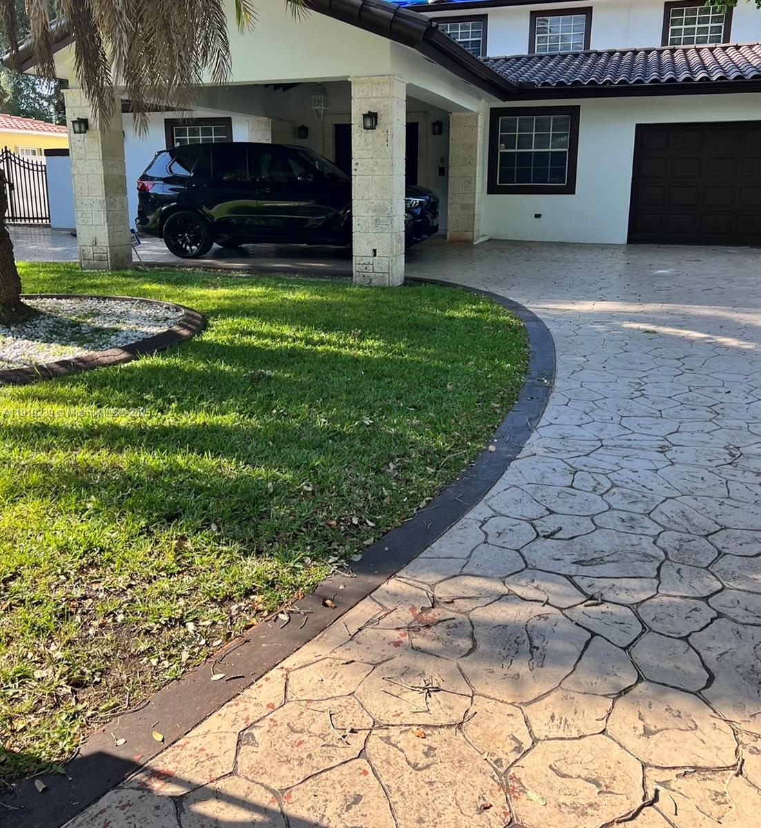 6284 Southwest 26th Street Miami, FL 33155 - Photo 3 of 25 a view of a backyard of the house