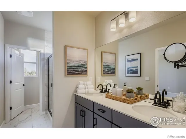 a bathroom with a granite countertop sink a toilet and a mirror