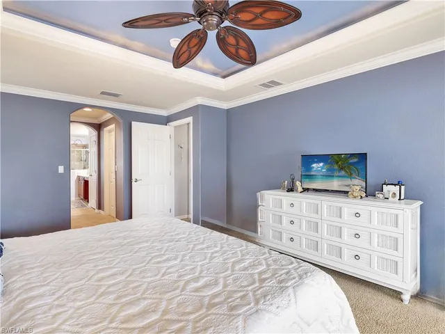 a bedroom with a bed and dresser