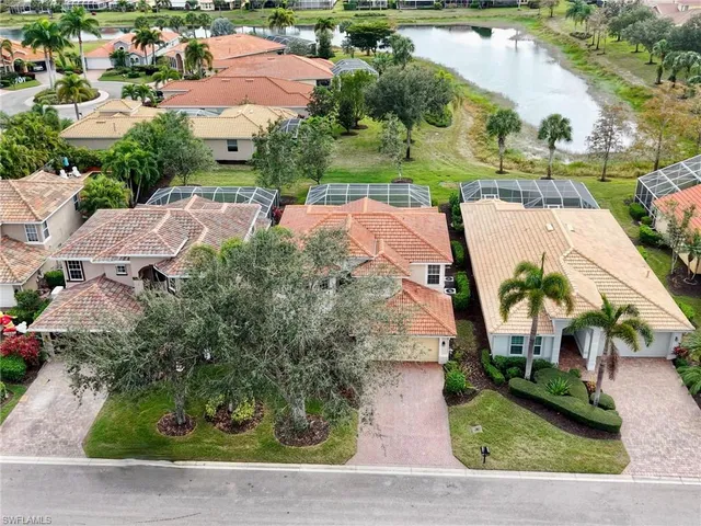 an aerial view of house with yard swimming pool and outdoor seating