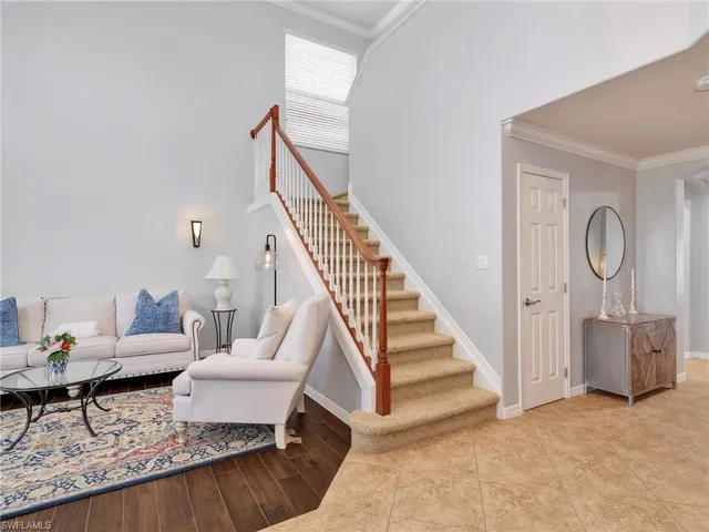 a living room with furniture and a rug