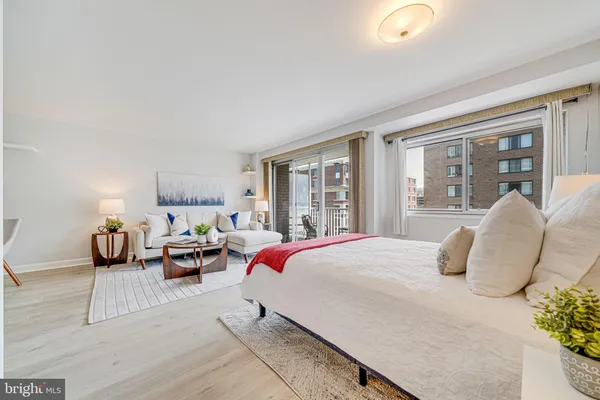 a bedroom with bed and window