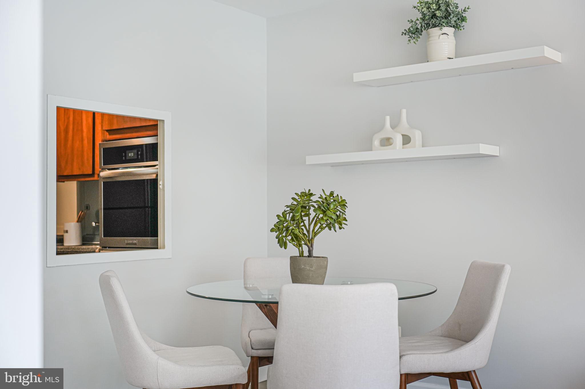 730 24th Street Northwest, Unit 612 Washington, DC 20037 - Photo 17 of 39 a view of a dining room with furniture