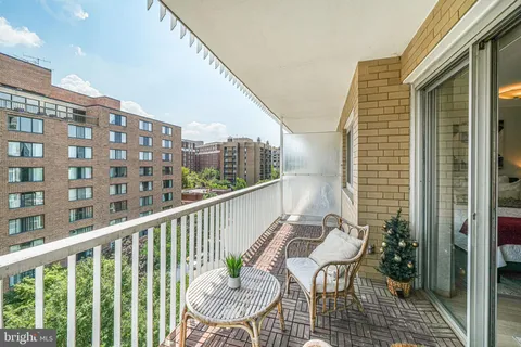 a view of a balcony with chairs