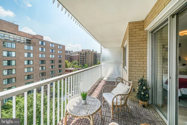 a view of a balcony with chairs