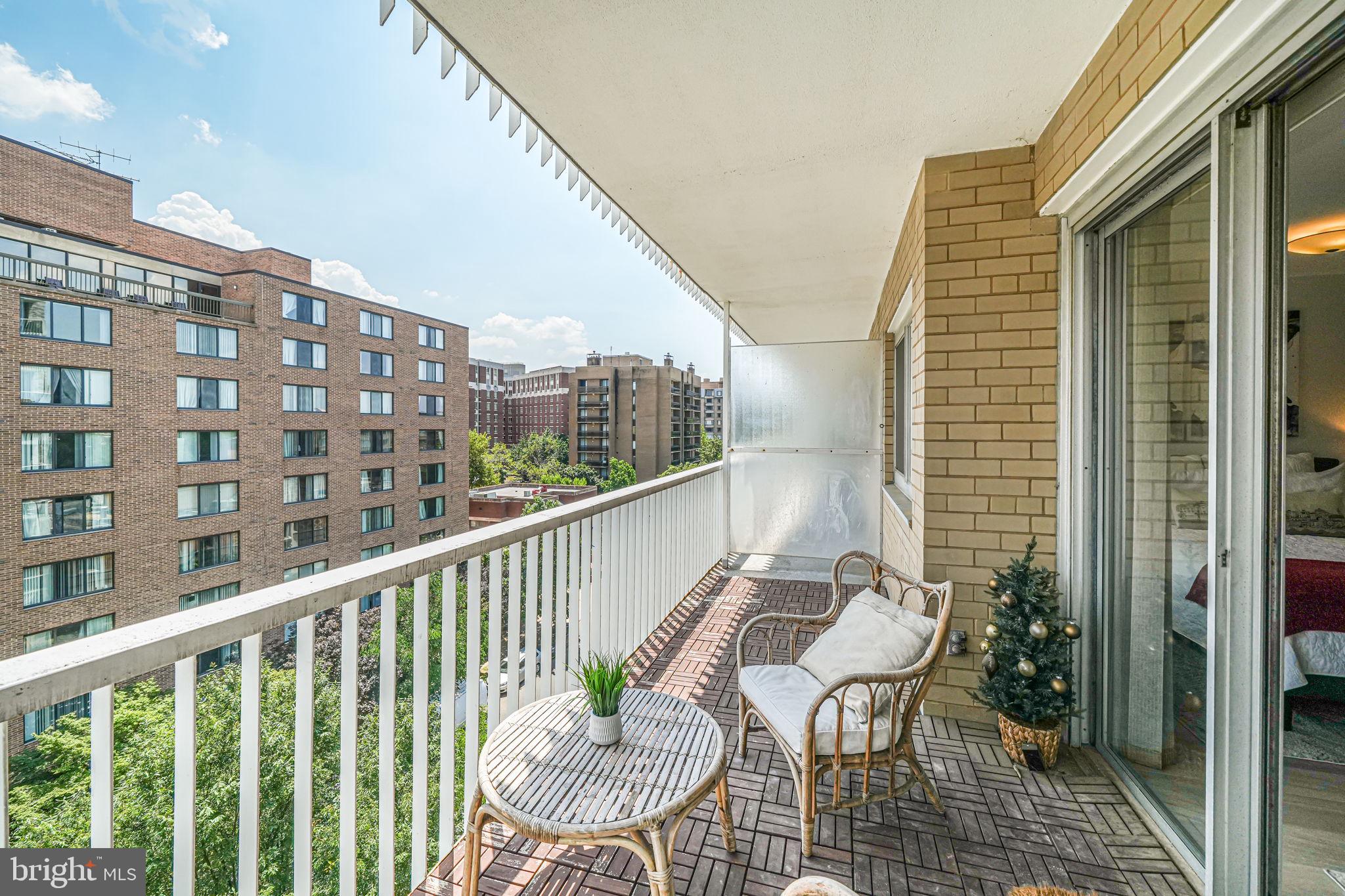 730 24th Street Northwest, Unit 612 Washington, DC 20037 - Photo 2 of 39 a view of a balcony with chairs