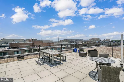 a view of a terrace with furniture and stove