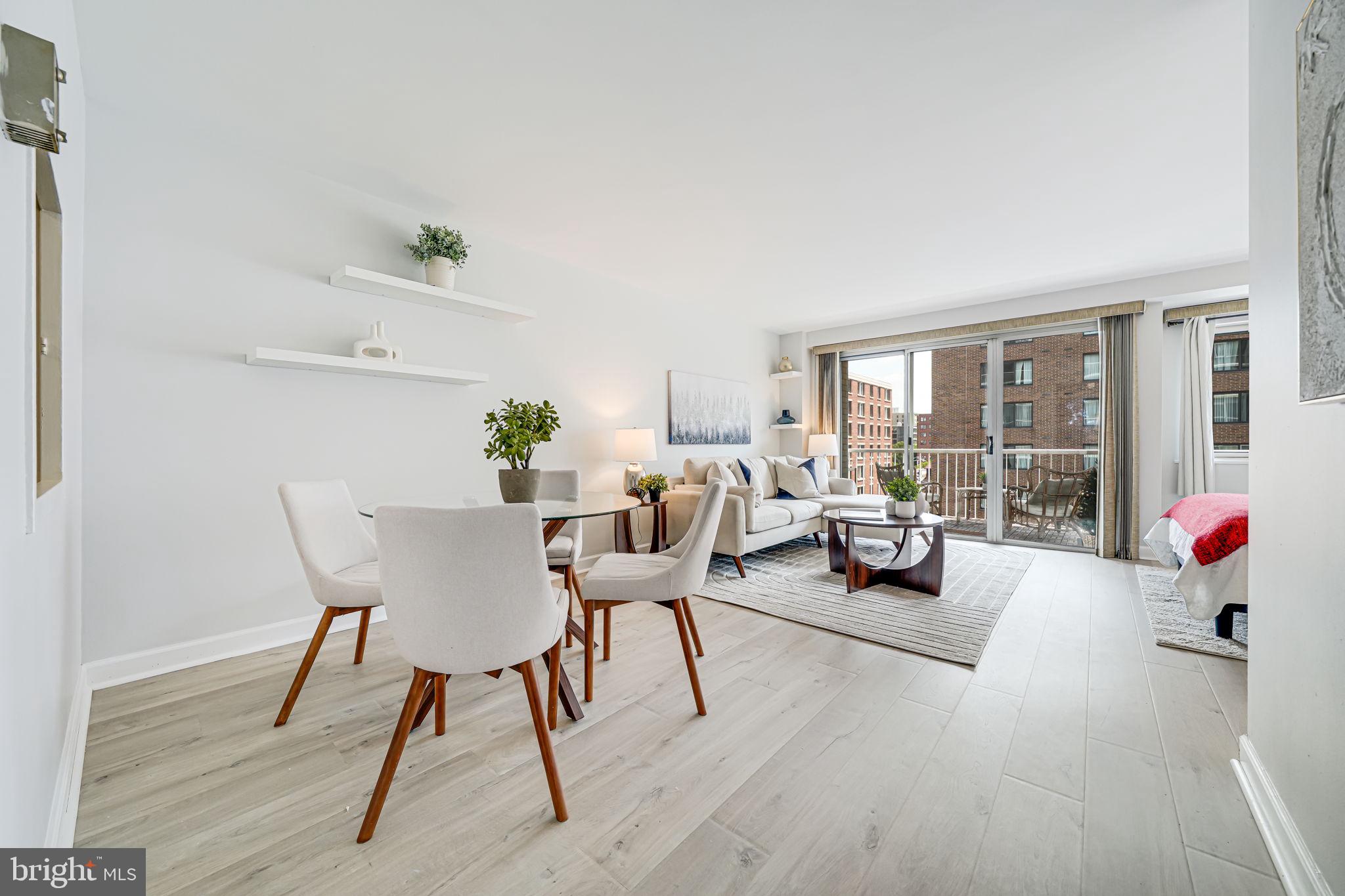 730 24th Street Northwest, Unit 612 Washington, DC 20037 - Photo 4 of 39 a living room with furniture and a potted plant